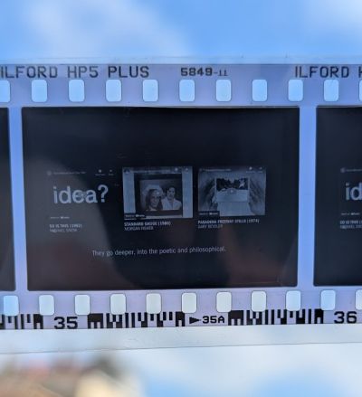 A section of black-and-white photo negative capturing a presentation slide.