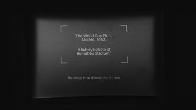 A still from \'Viewfinder\' (2025) by director Jon Beaton. A text slide on developed film as viewed through the photo camera body.