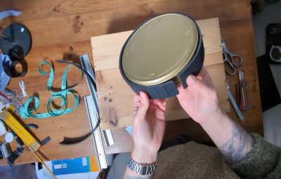 Jon Beaton building the mirror column of his praxinoscope out of a small Kodak film can.